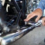 Mechanic repairing motorcycle